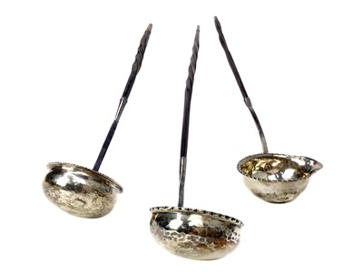 Lot 543 - A LOT OF THREE GEORGIAN SILVER TODDY LADLES