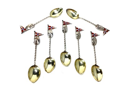Lot 547 - A SET OF SEVEN ENAMELLED SILVER TEASPOONS