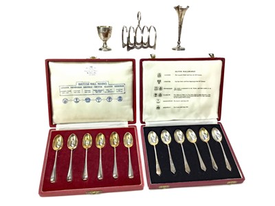 Lot 545 - A LOT OF TWO TWO CASED SETS OF SILVER TEASPOONS ALONG WITH A TOAST RACK, EGG CUP AND VASE