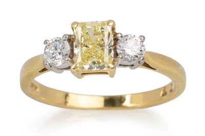 Lot 544 - YELLOW DIAMOND THREE STONE RING