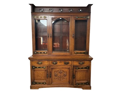 Lot 1216 - ARTS & CRAFTS OAK STAINED THREE DOOR BOOKCASE