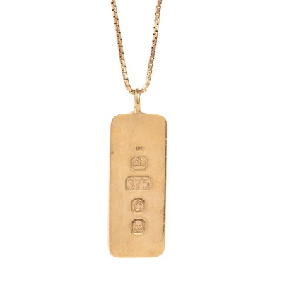 Lot 690 - GOLD INGOT PENDANT ON CHAIN