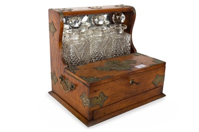 Lot 1645 - VICTORIAN OAK TANTALUS WITH GAMES COMPARTMENT