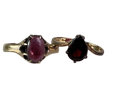 Lot 535 - TWO GARNET DRESS RINGS