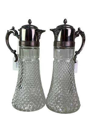 Lot 457 - PAIR OF GLASS CLARET JUGS