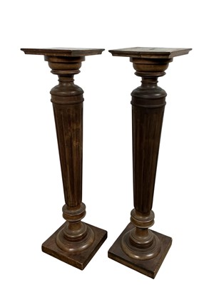 Lot 585 - PAIR OF STAINED PINE TORCHERE STANDS